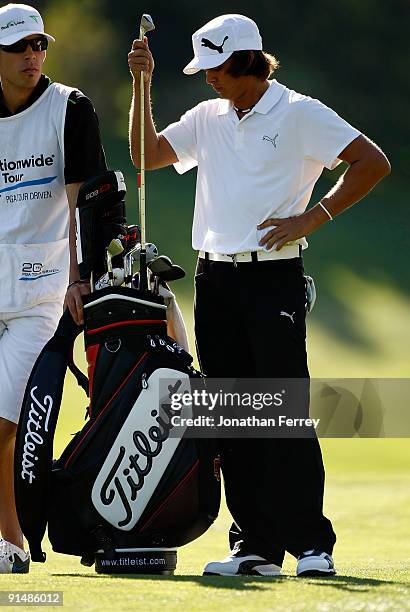 Rickie Fowler pulls a club from his bag during the first round of the Albertson's Boise Open at Hillcrest Country Club on September 17, 2009 in...