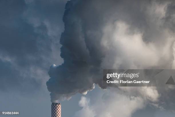 The chimney of the lignite-fired power station on the polish side near the polish-german-czech border triangle is pictured on February 05, 2018 in...