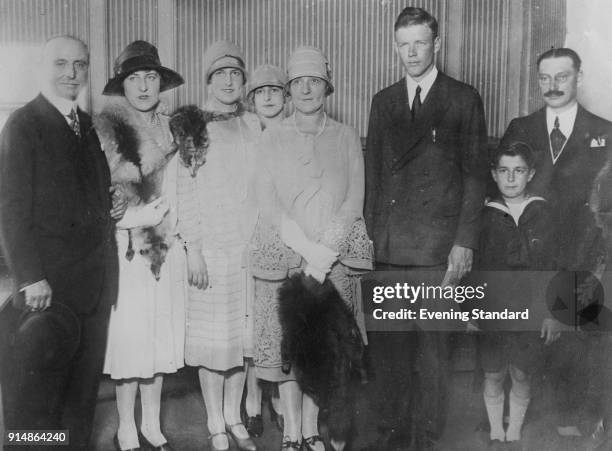American aviator Charles Lindbergh poses with French aviator Louis Blériot and Blériot's son and three daughters, circa 1927. Blériot made the first...