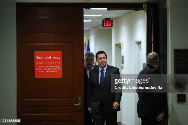 House Intelligence Committee Chairman Devin Nunes and Rep. Peter King leave the committee's secure meeting rooms in the basement of the U.S. Capitol...