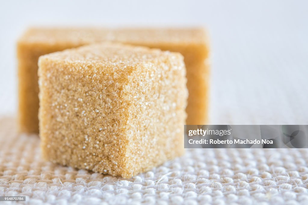 Brown sugar cube, close up of the sweet food