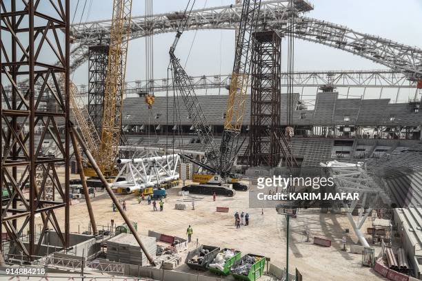 General view taken on February 6 shows workers on the construction site at the Al-Wakrah Stadium , a World Cup venue designed by celebrated...