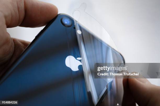 Berlin, Germany A protective film is peeled off a brand new Apple iphone 8 on February 06, 2018 in Berlin, Germany.