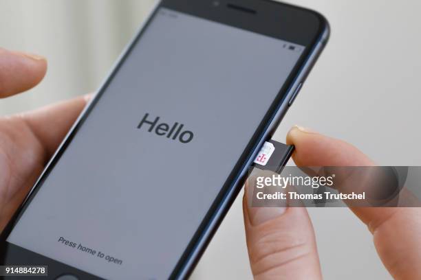 Berlin, Germany A SIM card from Deutsche Telekom is pushed into a smartphone on February 06, 2018 in Berlin, Germany.