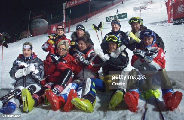 Some of the skiers sit in the finish area in order to protest against the bad track conditions after the first run of the women's night slalom of the...