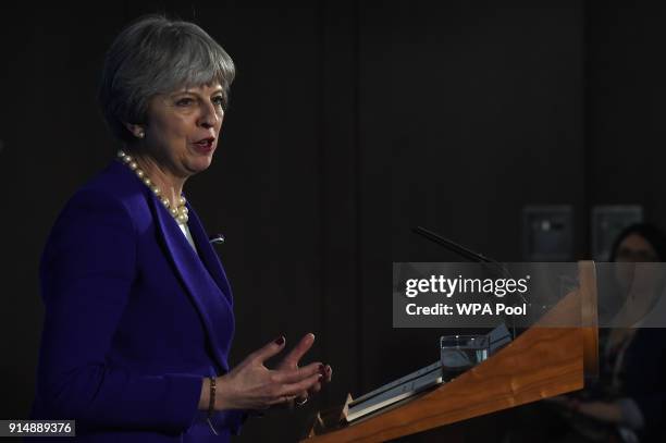 British Prime Minister Theresa May delivers a speech on public life to mark the centenary of women's suffrage in the UK on February 6, 2018 in...