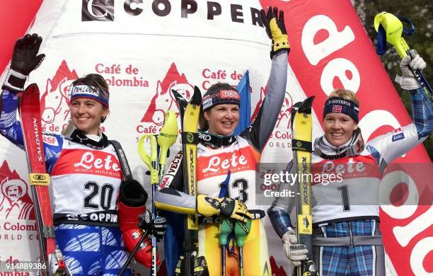 Winners of the women's World Cup slalom celebrate their victories 20 November 1999 at Copper Mountain, Colorado. From left are: Christel Saioni of...