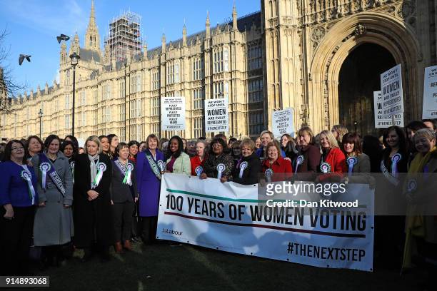 Female members of the Shadow Cabinet and Labour politicians stand on college green with a '100 Years of Women Voting' banner on February 6, 2018 in...