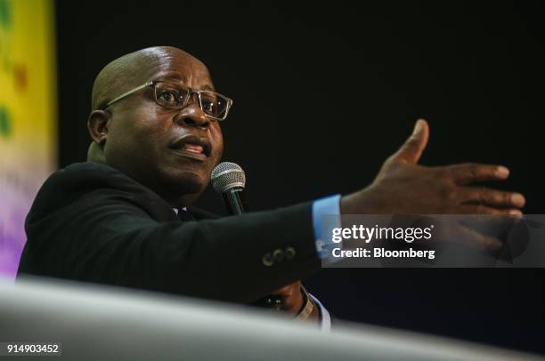 Ben Magara, chief executive officer of Lonmin Plc, gestures as he speaks during a panel discussion on the second day of the Investing in African...