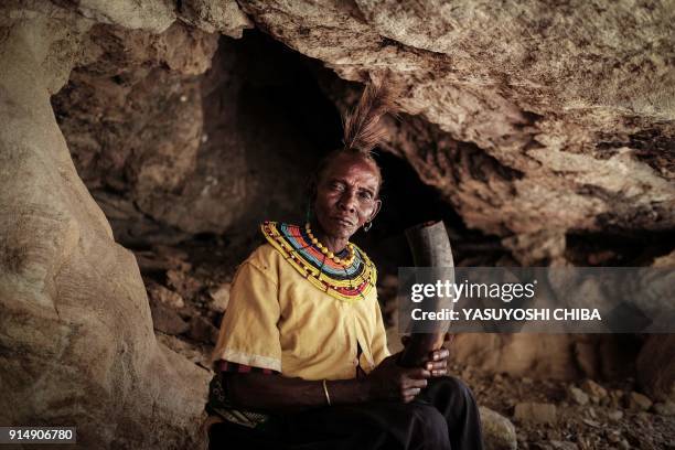 Ex-female genital mutilation cutter of the Pokot tribe Chepchai Limaa poses in the abandoned cave where girls rested to heal after their...
