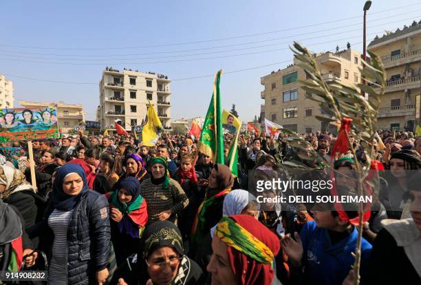 Syrian Kurds, Arabs, and Syriacs bussed in from across northern Syria demonstrate in the centre of the Kurdish city of Afrin on February 6 in a show...