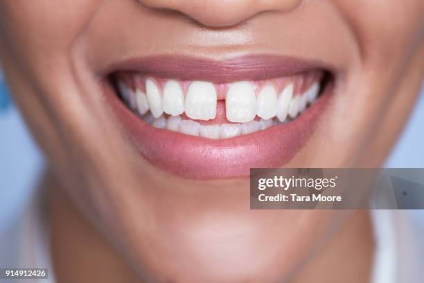 closeup of woman's mouth smiling - mund stock-fotos und bilder