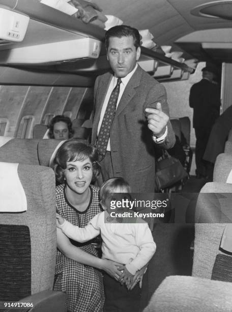 Italian actress Gina Lollobrigida leaves Rome for Los Angeles by air, with her husband Milko Skofic and their son Milko Jr., 22nd April 1960.