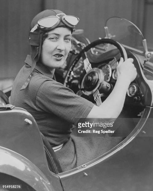 British racing driver Betty Haig , the niece of Field Marshal Earl Haig, at the wheel of her car before the German Olympic nine-day car rally through...