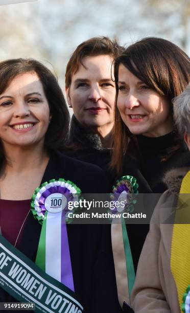 Caroline Flint, Mary Creagh, Liz Kendall. Female members of the shadow cabinet and Labour politicians wearing suffrage rosettes and banners stand...