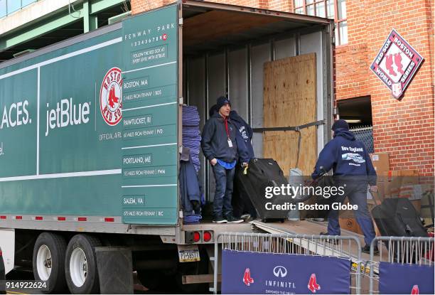 Bags are loaded onto the Boston Red Sox equipment truck outside Fenway Park in Boston on Feb. 5, 2018. Truck Day is the annual changing of the sports...