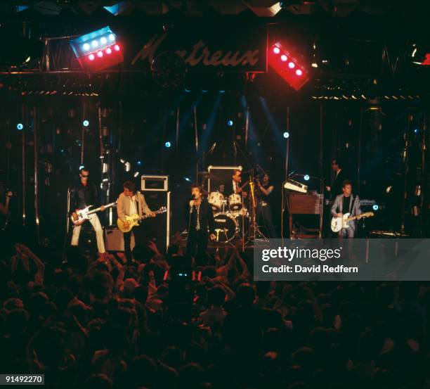 American pop group Huey Lewis and the News performing at Montreux, Switzerland, 1985. Left to right: bassist Mario Cipollina, guitarist Johnny Colla,...