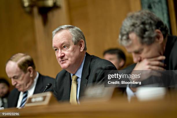 Senator Mike Crapo, a Republican from Idaho and chairman of the Senate Banking, Housing and Urban Development Committee, center, makes an opening...