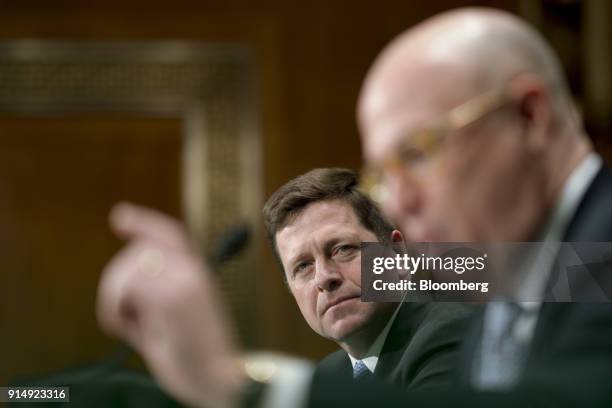 Jay Clayton, chairman of the U.S. Securities and Exchange Commission , center, listens during a Senate Banking, Housing and Urban Development...