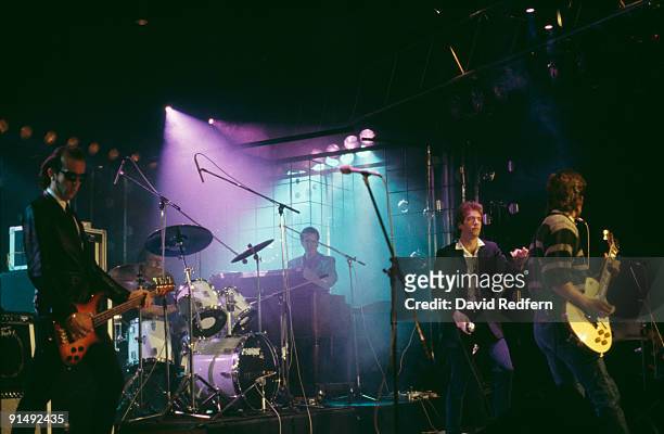 American pop group Huey Lewis and the News performing, 1985. Left to right: bassist Mario Cipollina, drummer Bill Gibson, keyboard player Sean...