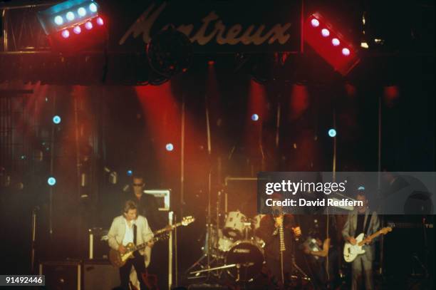 American pop group Huey Lewis and the News performing at Montreux, Switzerland, 1985. Left to right: guitarist Johnny Colla, bassist Mario Cipollina,...