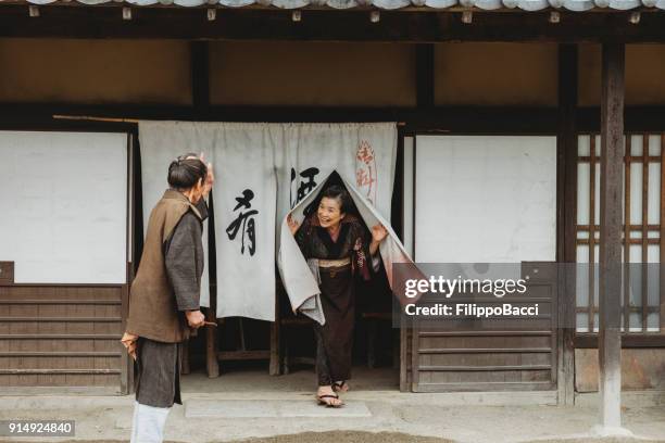 japanese couple in a traditional village - fusuma doors stock pictures, royalty-free photos & images