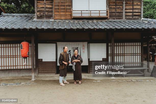 japanese couple in a traditional village - fusuma doors stock pictures, royalty-free photos & images