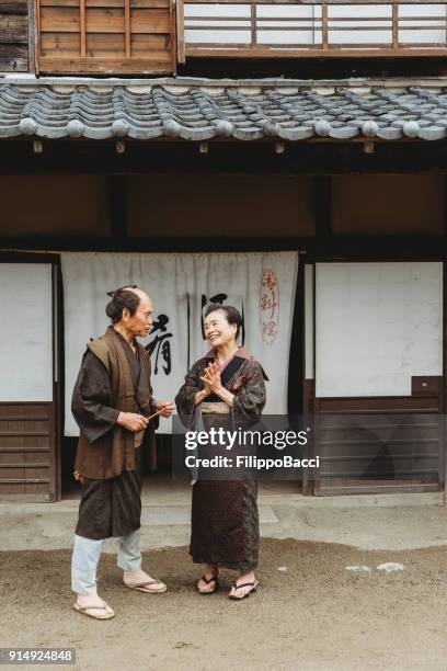 japanese couple in a traditional village - fusuma doors stock pictures, royalty-free photos & images