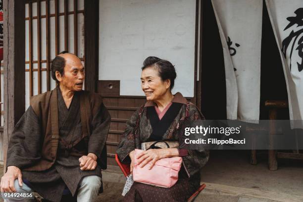japanese couple in a traditional village - fusuma doors stock pictures, royalty-free photos & images