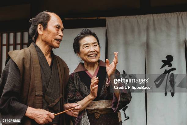 japanese couple in a traditional village - fusuma doors stock pictures, royalty-free photos & images