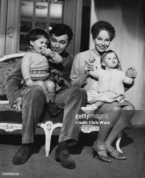 English theatre director Peter Hall , director of the Shakespeare Memorial Theatre in Stratford-Upon-Avon, with his wife, actress Leslie Caron, their...