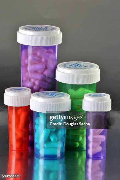 modern healthcare in a colored pill bottles - mdma stock pictures, royalty-free photos & images