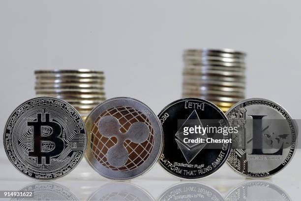 In this photo illustration, a visual representation of digital cryptocurrencies, Bitcoin, Ripple, Ethernum and Litecoin is displayed on February 6,...