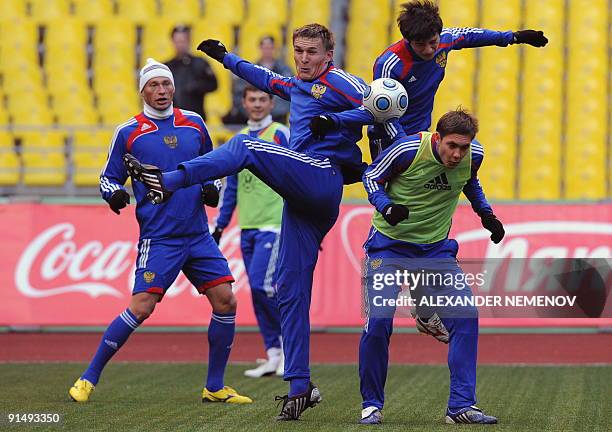 Inidentified Russian footballers play during a training session in Moscow on October 6, 2009. Germany are just a point ahead of Russia in the...