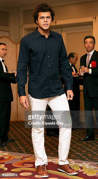 Jo-Wilfried Tsonga of France poses as he attends a welcome reception on day two of the Rakuten Open Tennis tournament at Hotel Grand Pacific Le Daiba...