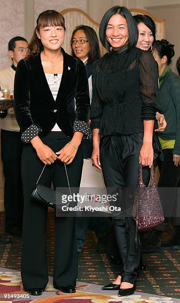 Ayumi Morita and Kimiko Date Krumm of Japan pose as they attend a welcome reception on day two of the Rakuten Open Tennis tournament at Hotel Grand...
