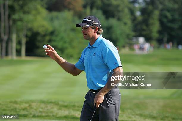 Retief Goosen of South Africa holds up his ball during the final round of the Deutsche Bank Championship at TPC Boston held on September 7, 2009 in...