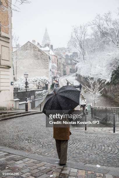 Montmartre Streets under snowfall on February 6, 2018 in Paris, France. Several french departments are affected by a snow episode for two days.