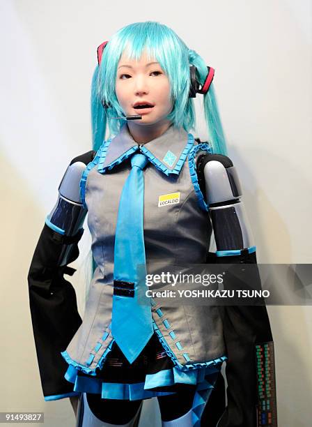 Humanoid robot "HRP-4C", developed by Japanese institute AIST, sings songs accompanied by Yamaha's autoplay piano is, for a demonstration of...