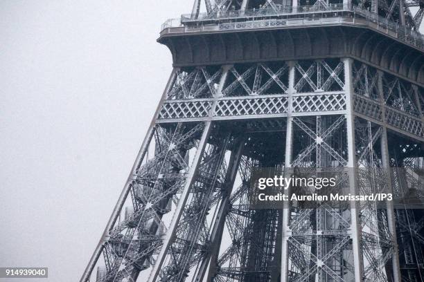 The Eiffel Tower under snowfall. Temperatures dropped since a few days now with the snowfall and the emergency cold plan has been launched on...