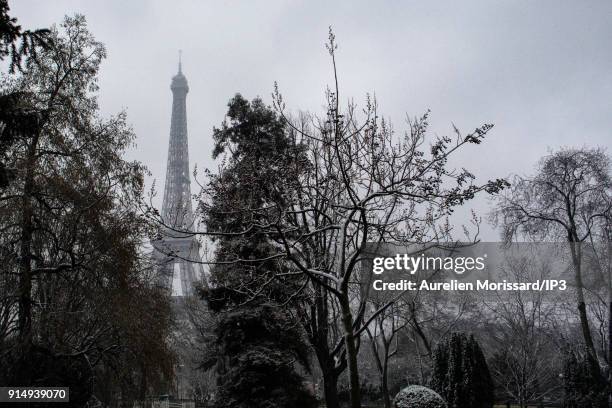 The Eiffel Tower under snowfall. Temperatures dropped since a few days now with the snowfall and the emergency cold plan has been launched on...