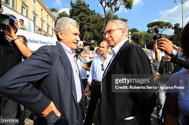 Massimo D'Alema talks to the Secretary General of CGIL, Guglielmo Epifani at a demonstration to defend freedom of the press in Italy in the Piazza...