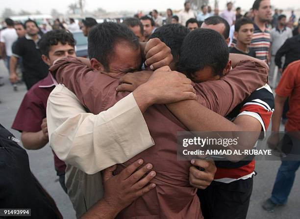 Relatives hug a prisoner , one of 32 released on September 28, 2009 in Baghdad after being freed from jail. More than 100 Iraqi Shiite insurgents...