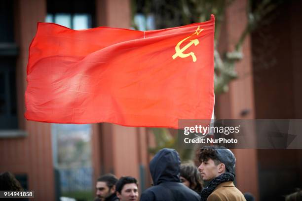 Young man carries a red flag during the demostration. More than 1000 students, highschool students, teachers demonstrated against the Vidal's law...