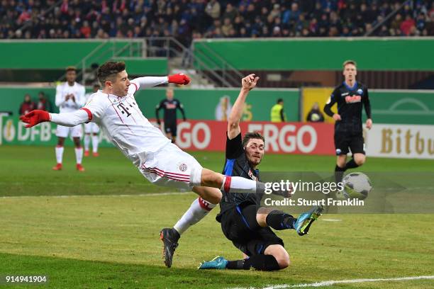 Robert Lewandowski of Muenchen scores the second goal during the DFB Pokal quater final match between SC Paderborn and Bayern Muenchen at Benteler...