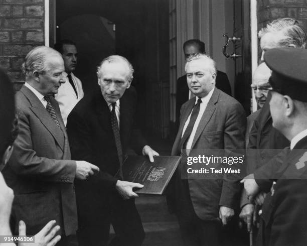 From right to left, Harold Wilson, the Leader of the Opposition, Prime Minister Sir Alec Douglas-Home, and Selwyn Lloyd, Leader of the House, arrive...