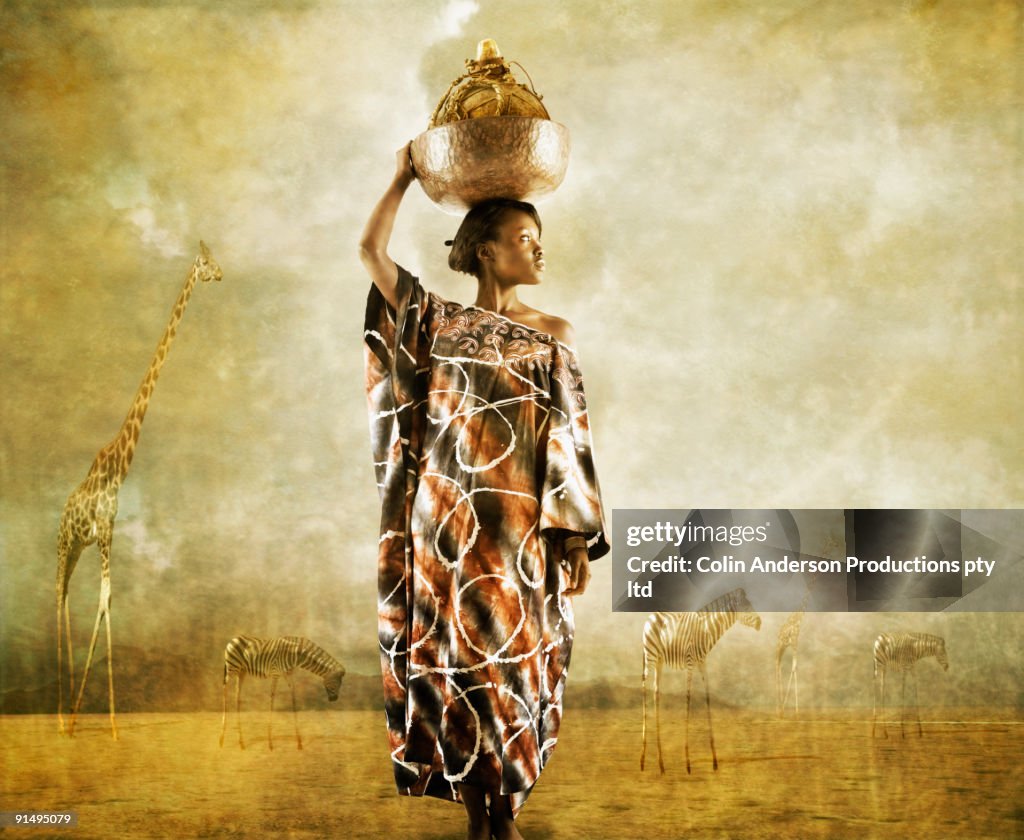 African woman holding bowl on head