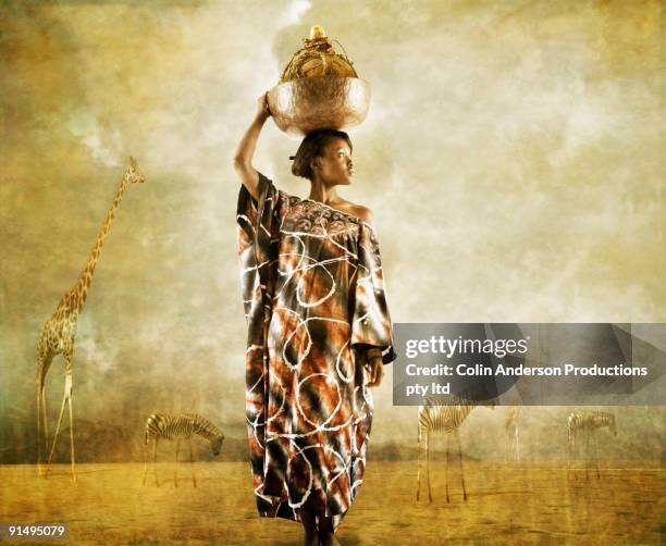 african woman holding bowl on head - afrikanerin korb tragen stock-fotos und bilder