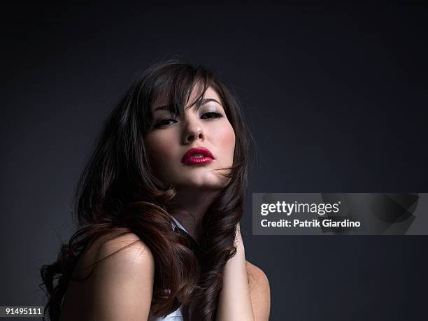 mixed race woman with hand in hair - latina glamour models stock pictures, royalty-free photos & images