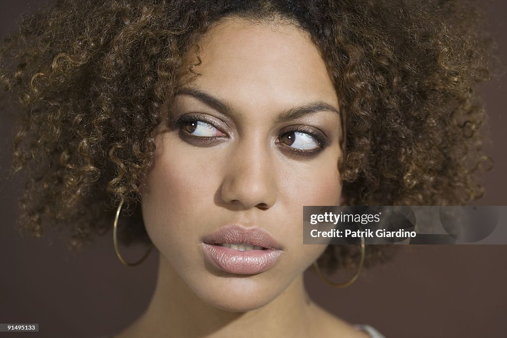 Mixed Race woman looking sideways